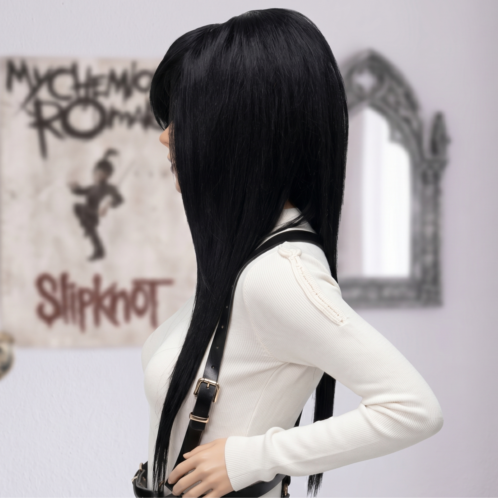 Side view of a black goth scene wig with long layered hair, full volume and smooth straight texture.