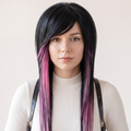 Black and pink emo scene wig with side-swept bangs, long layered front pieces and soft pastel pink highlights worn on a model.