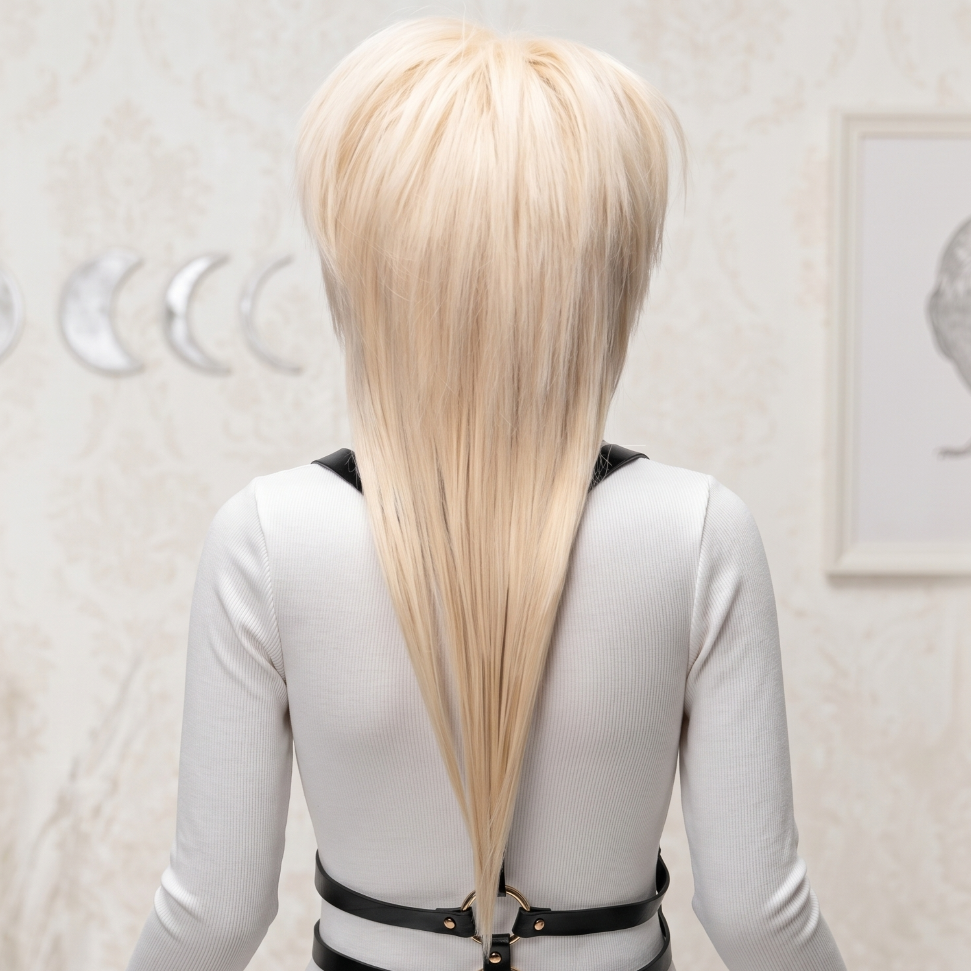 Back view of a long blonde layered wig, showing the smooth length, volume and tapered shape.