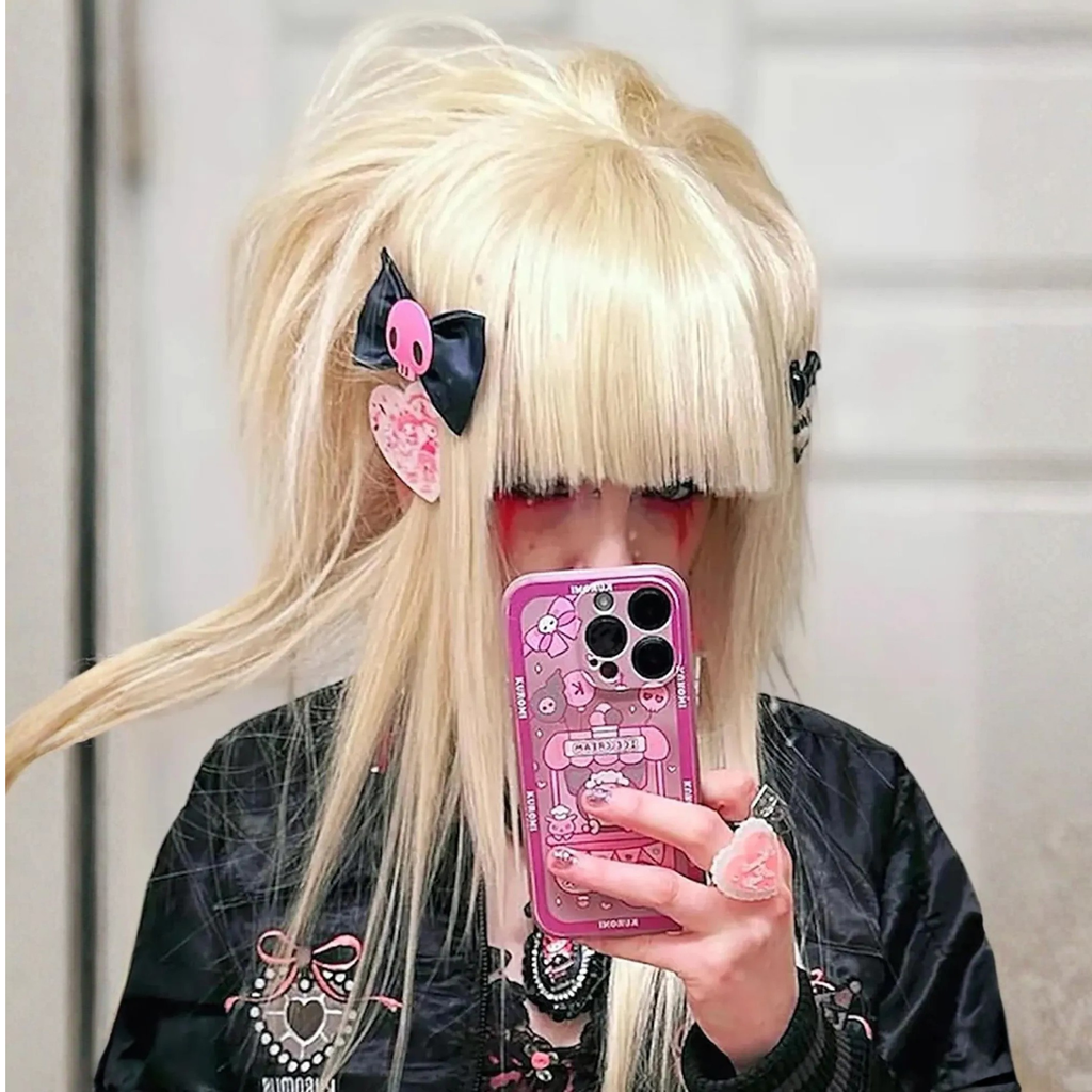 Customer style photo wearing a blonde scene wig with straight bangs and alternative fashion styling.