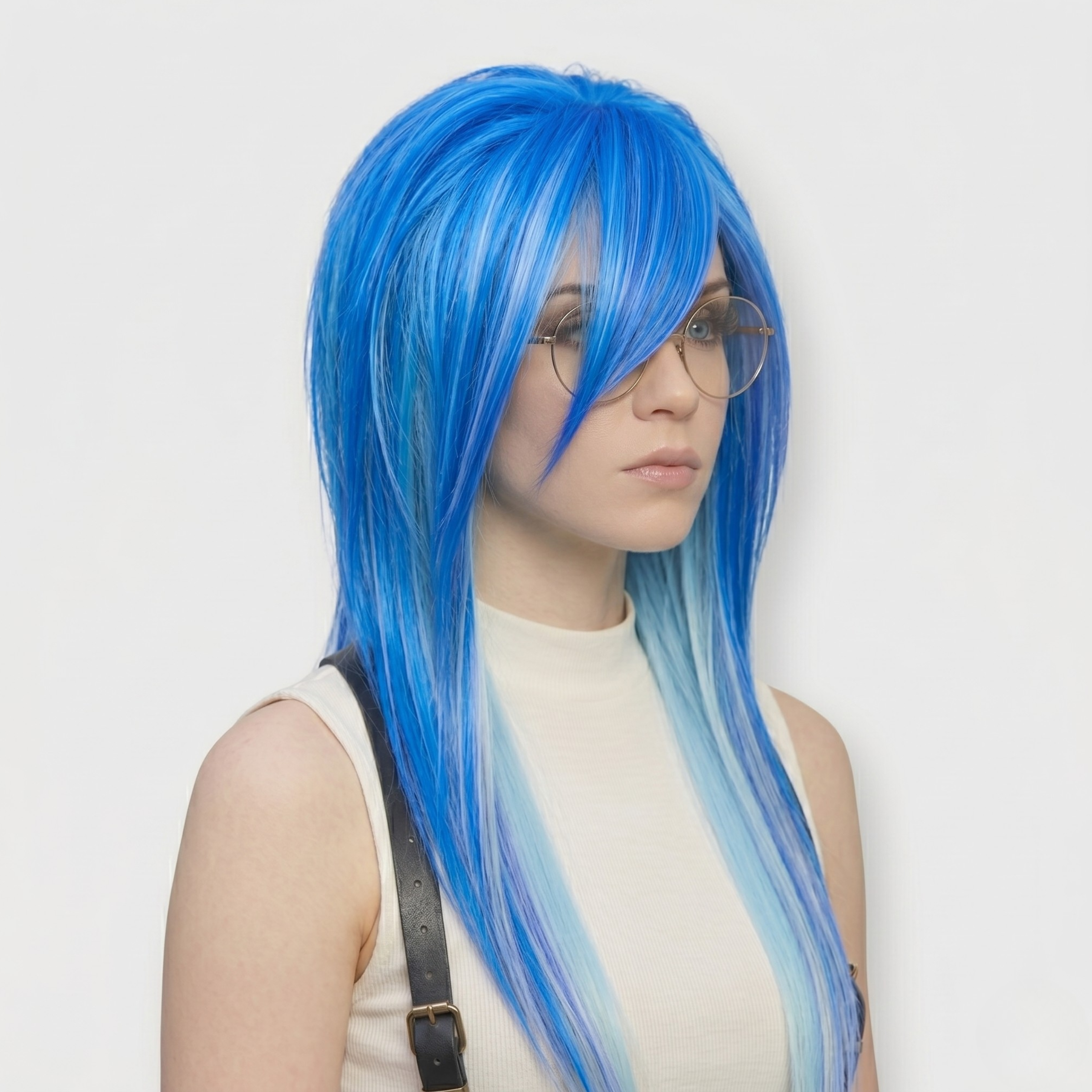 Angled Front View of Model Wearing The Blue Scene Emo Wig with Spiky Layers and Side Bangs – Long Shaggy Alternative Goth Wig, Electric Blue Ombre Style for Cosplay, Drag or Anime Look