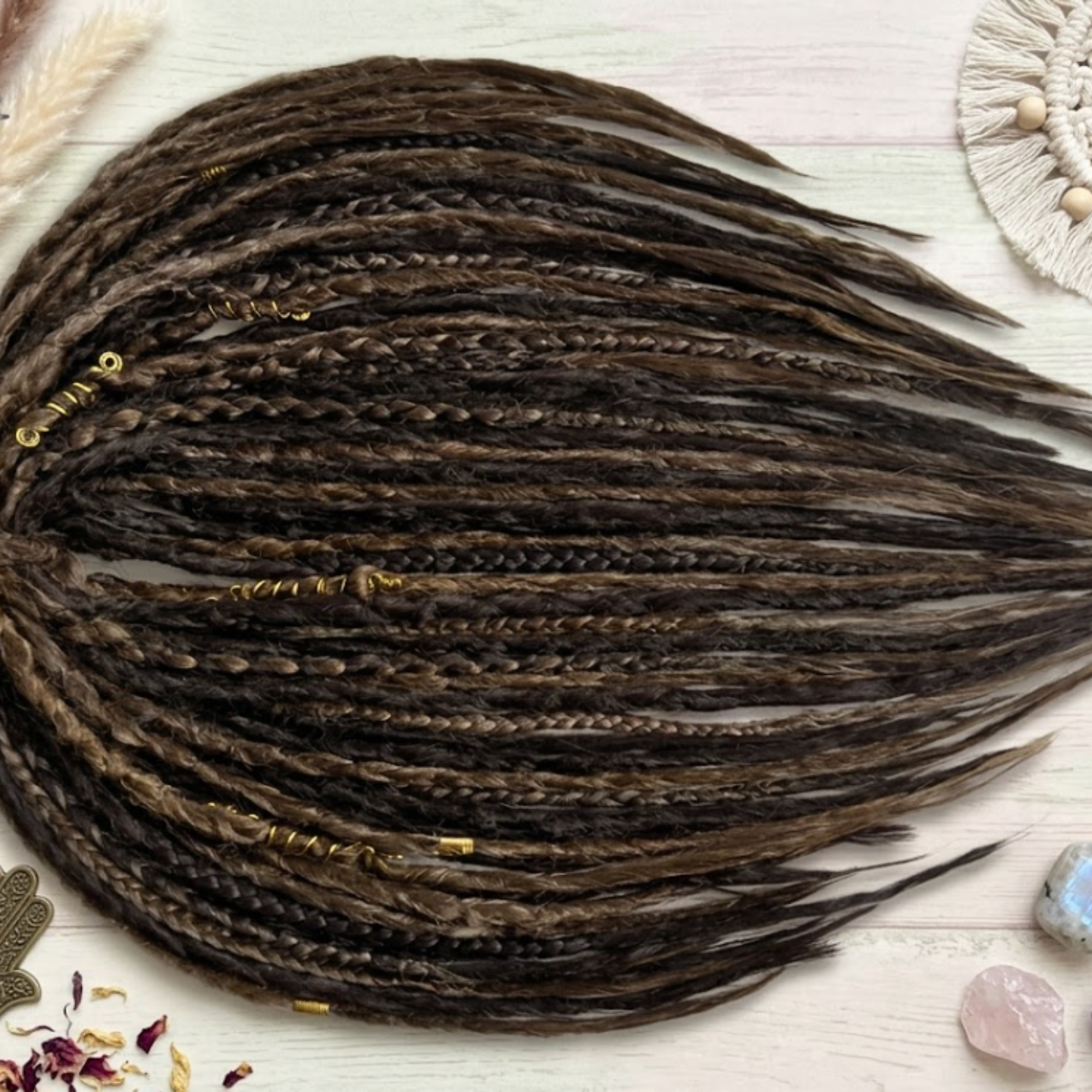 Close-up of brown synthetic dreadlock extensions showing soft crochet texture, plaits, wraps and natural loose ends.