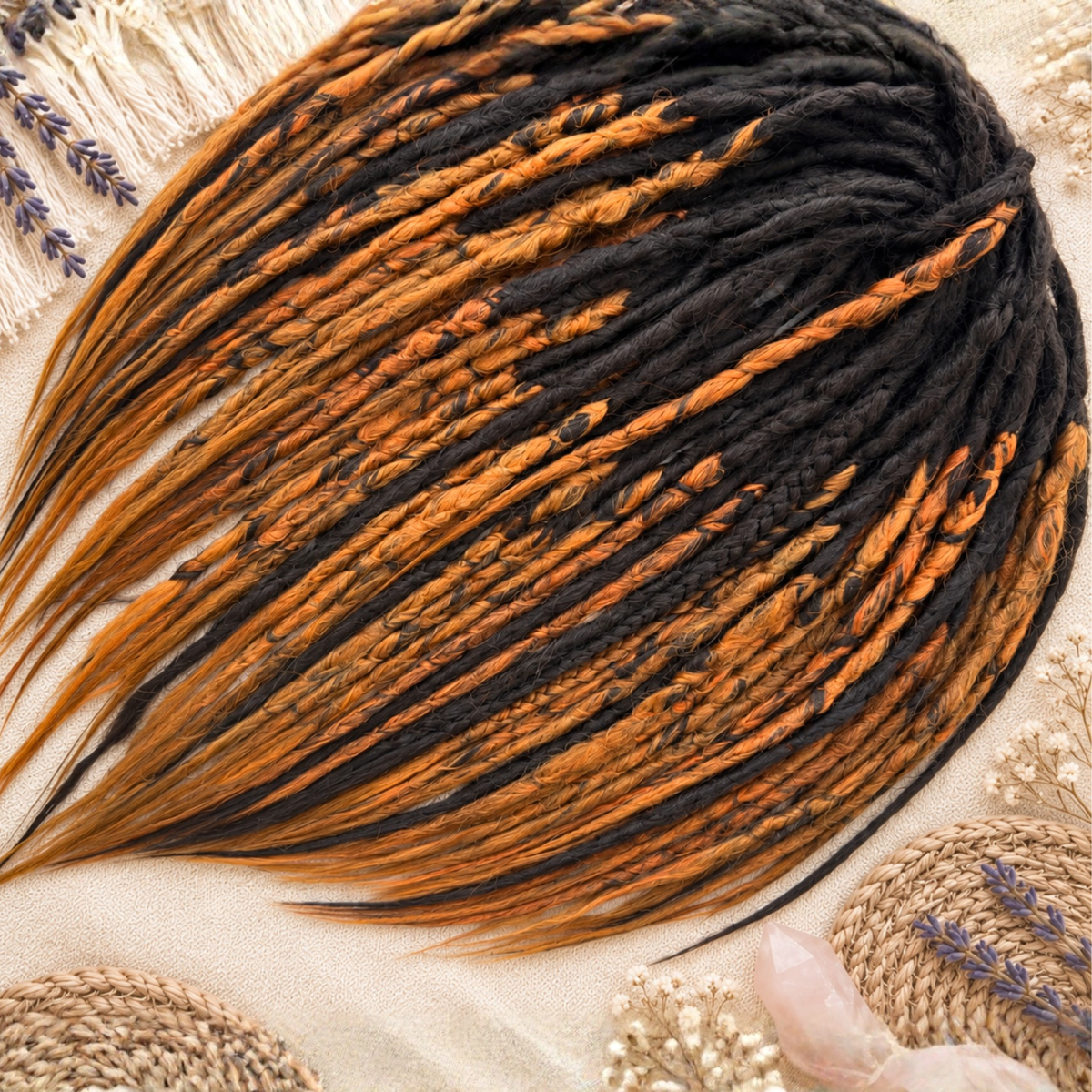 Angled view of handmade dark brown and copper ginger faux loc extensions with soft crochet dreads, mixed braided details and long tapered loose ends on a neutral boho background.