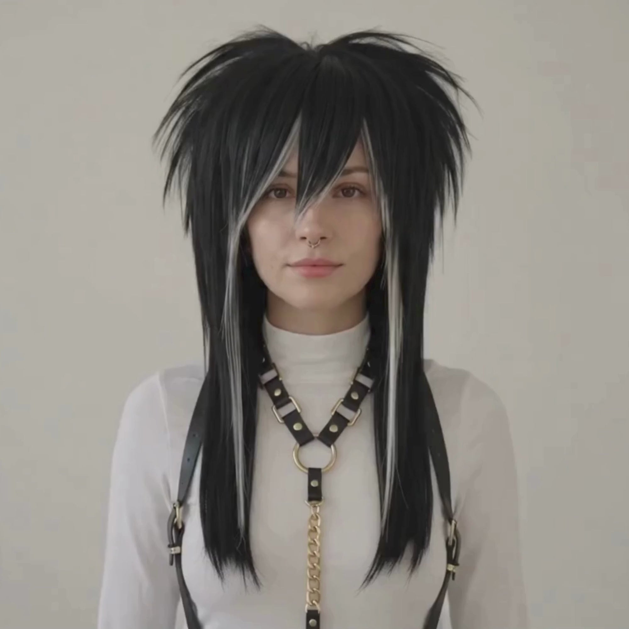 Showcasing video of black and blonde skunk stripe emo wig with spiky layered crown and long straight lengths.