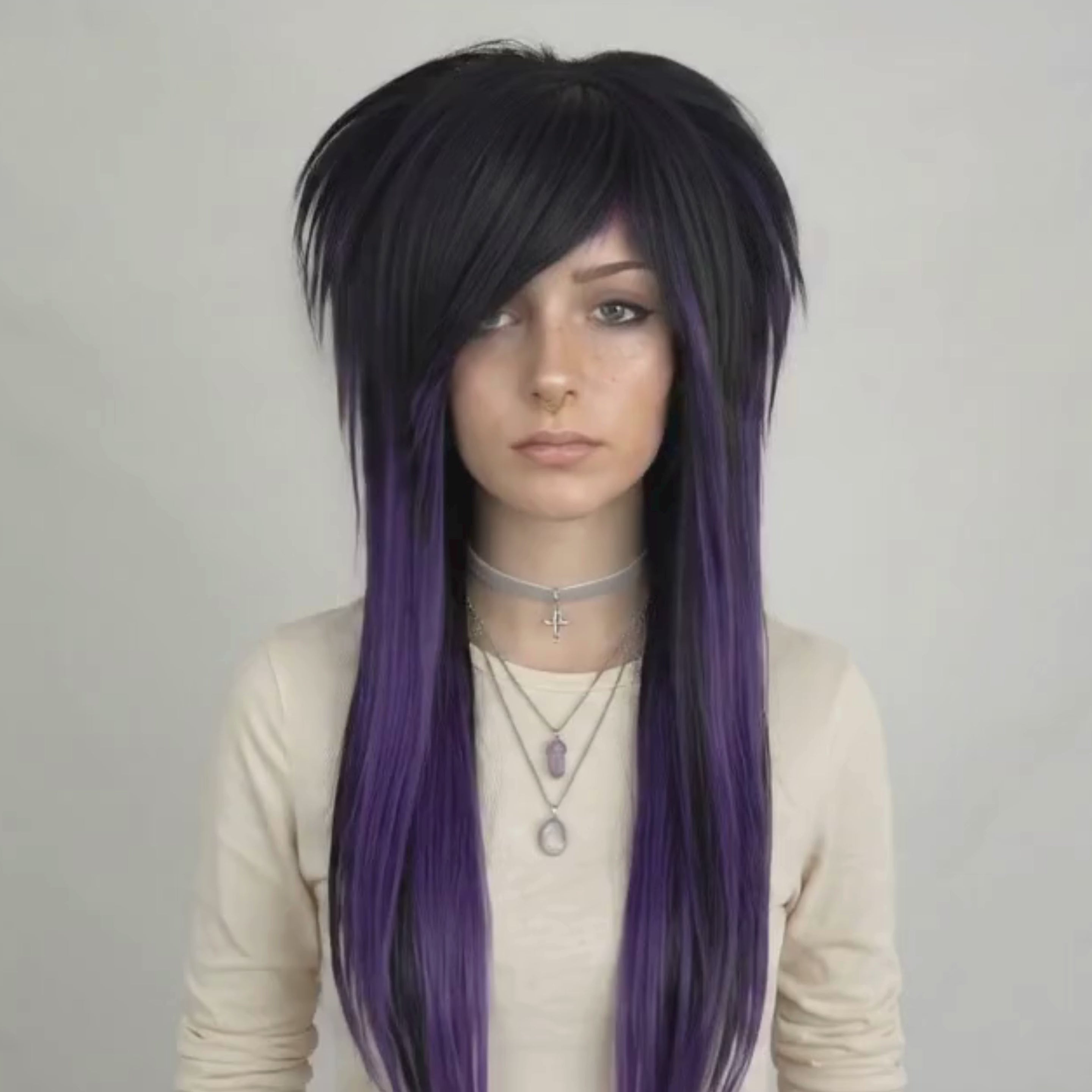 Showcasing different angle of  emo scene wig featuring black and dark purple synthetic hair with long layers, side fringe bangs, and full volume, suitable as a fashionable chemo wig, handmade for women or men who love punk, goth, or visual kei style.