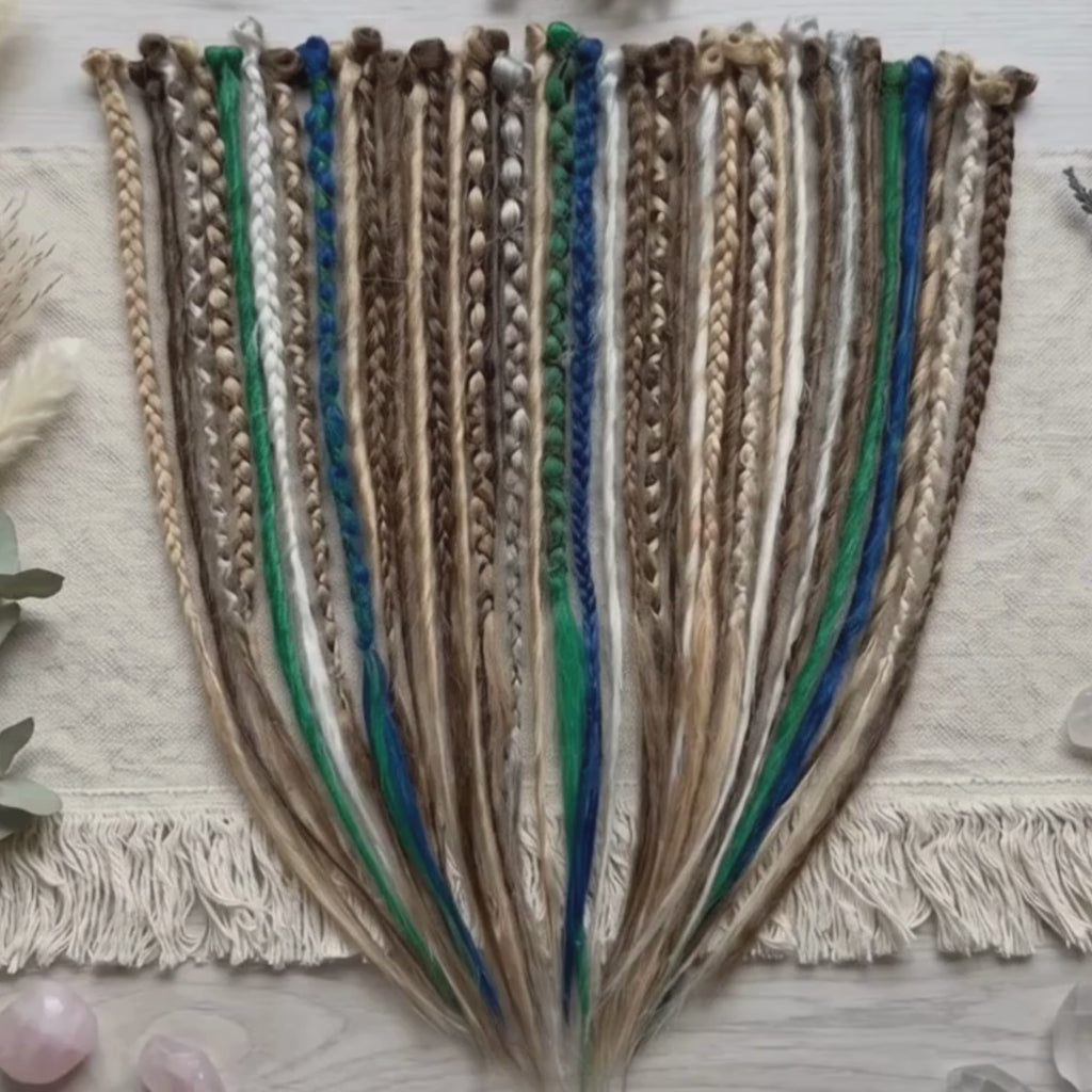 Showcase video of brown blonde dreadlock extensions with blue and green accents, featuring handmade loose end synthetic dreads available as single ended or double ended.